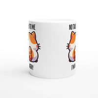 a white coffee mug with a cartoon cat on it