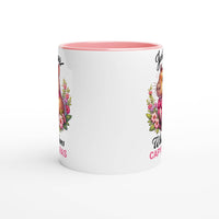 a white coffee mug with a pink rim