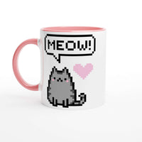 a pink and white coffee mug with a cat saying meow