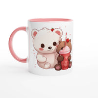 a coffee mug with a picture of a bear and a cupcake
