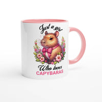 a pink and white mug with a picture of a hamster on it