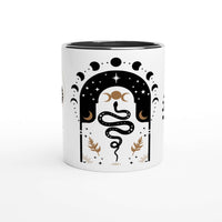 a white coffee mug with a snake on it