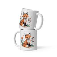 two coffee mugs with a picture of a fox on them