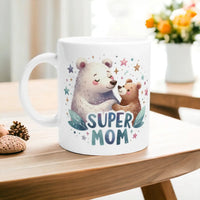 a coffee mug with a picture of a bear and a bear cub on it